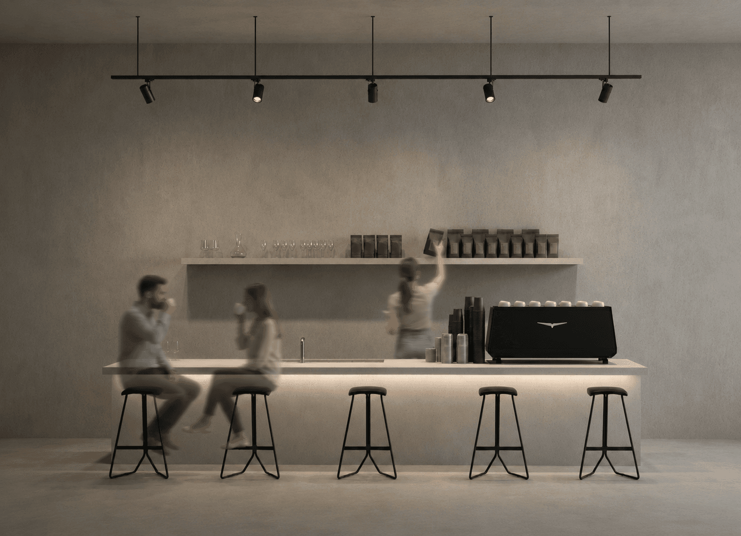 The reading café: a concrete bar under a line of hanging track lights, two visitors seated with coffee.