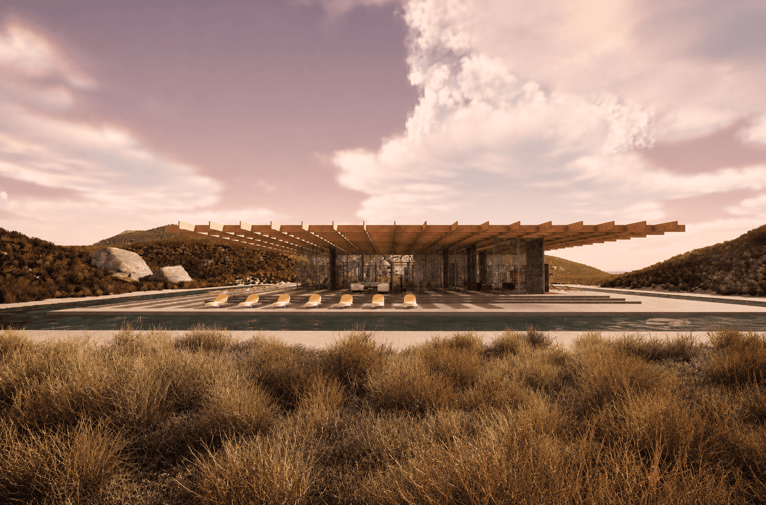 The pavilion on the horizon, seen across dry desert grass.