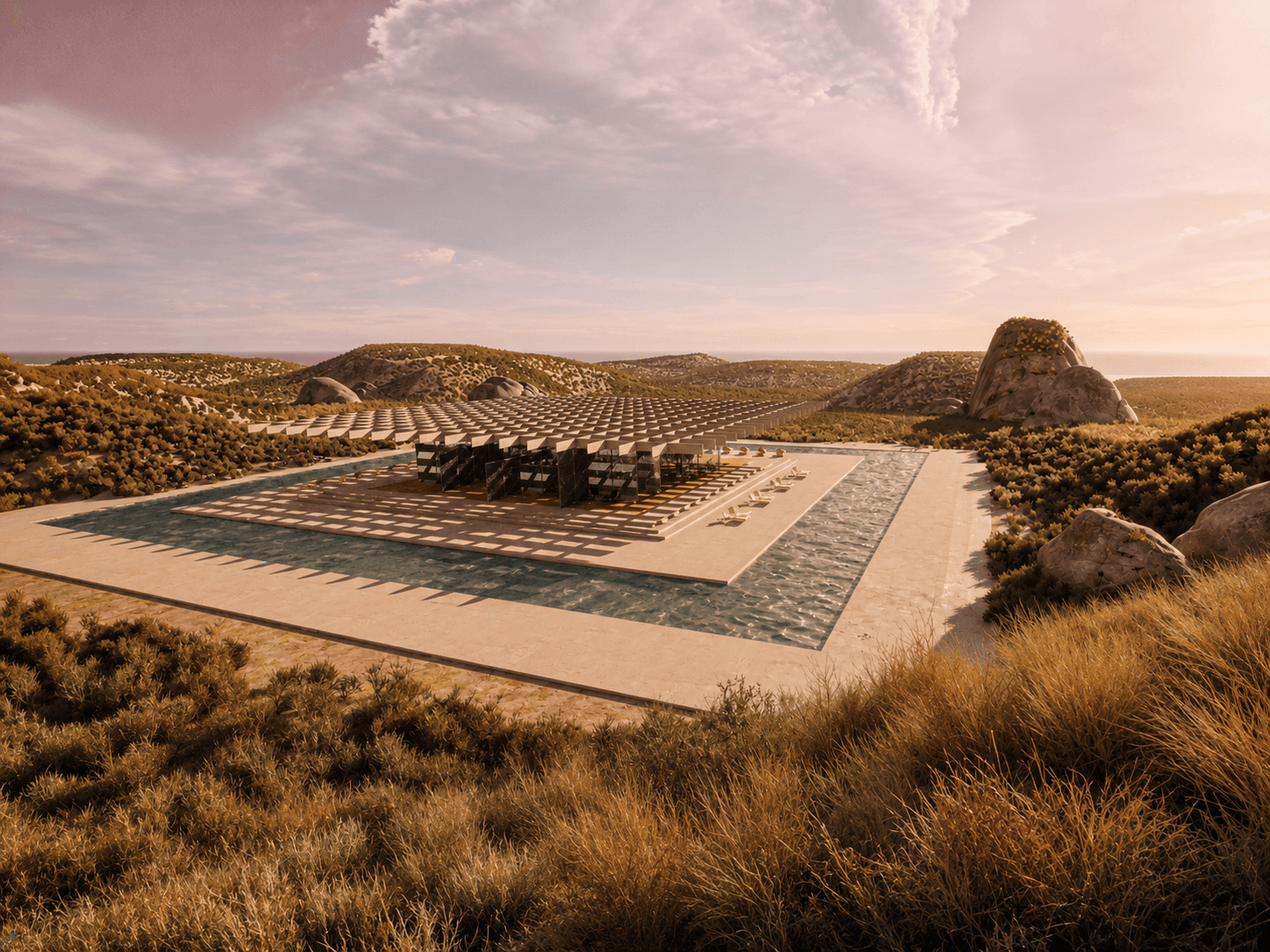 The whole complex seen from a distance, set low in a desert basin with the pool in the foreground.