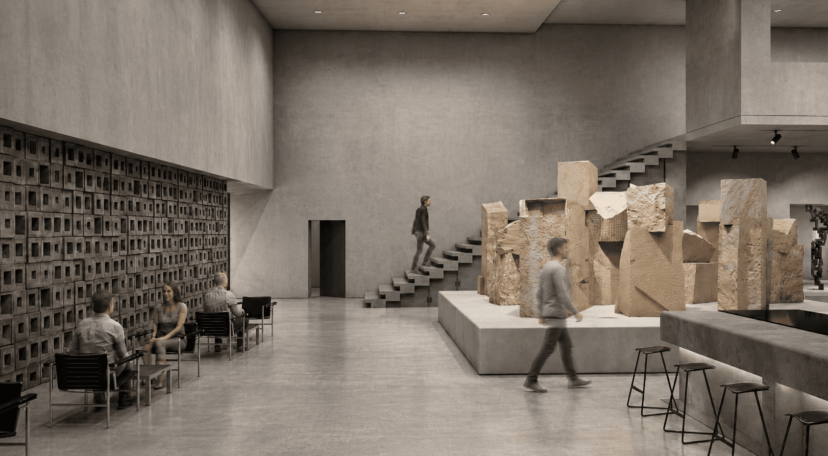 Exhibition hall: raw sandstone blocks stacked on a plinth beside a cantilevered concrete stair, the perforated block wall and bar beyond.